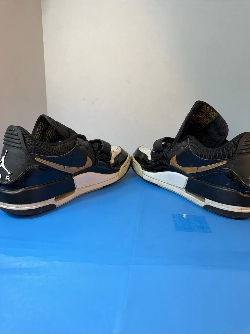 Jordan Black, White & Gold Strap Sneakers